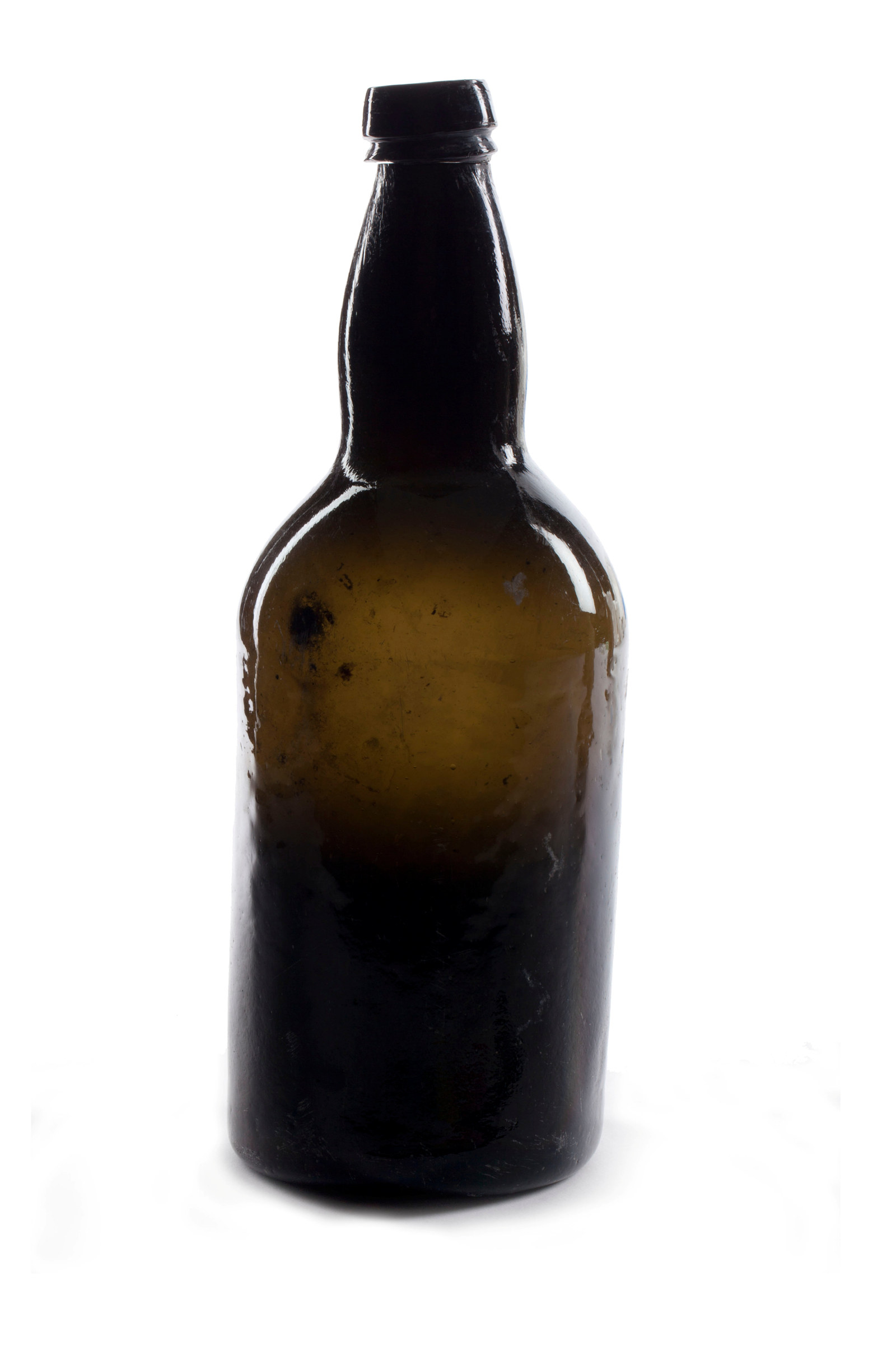 Alcohol bottle, dark olive glass, early -mid nineteenth century, excavated from beneath the ground floor of Hyde Park Barracks