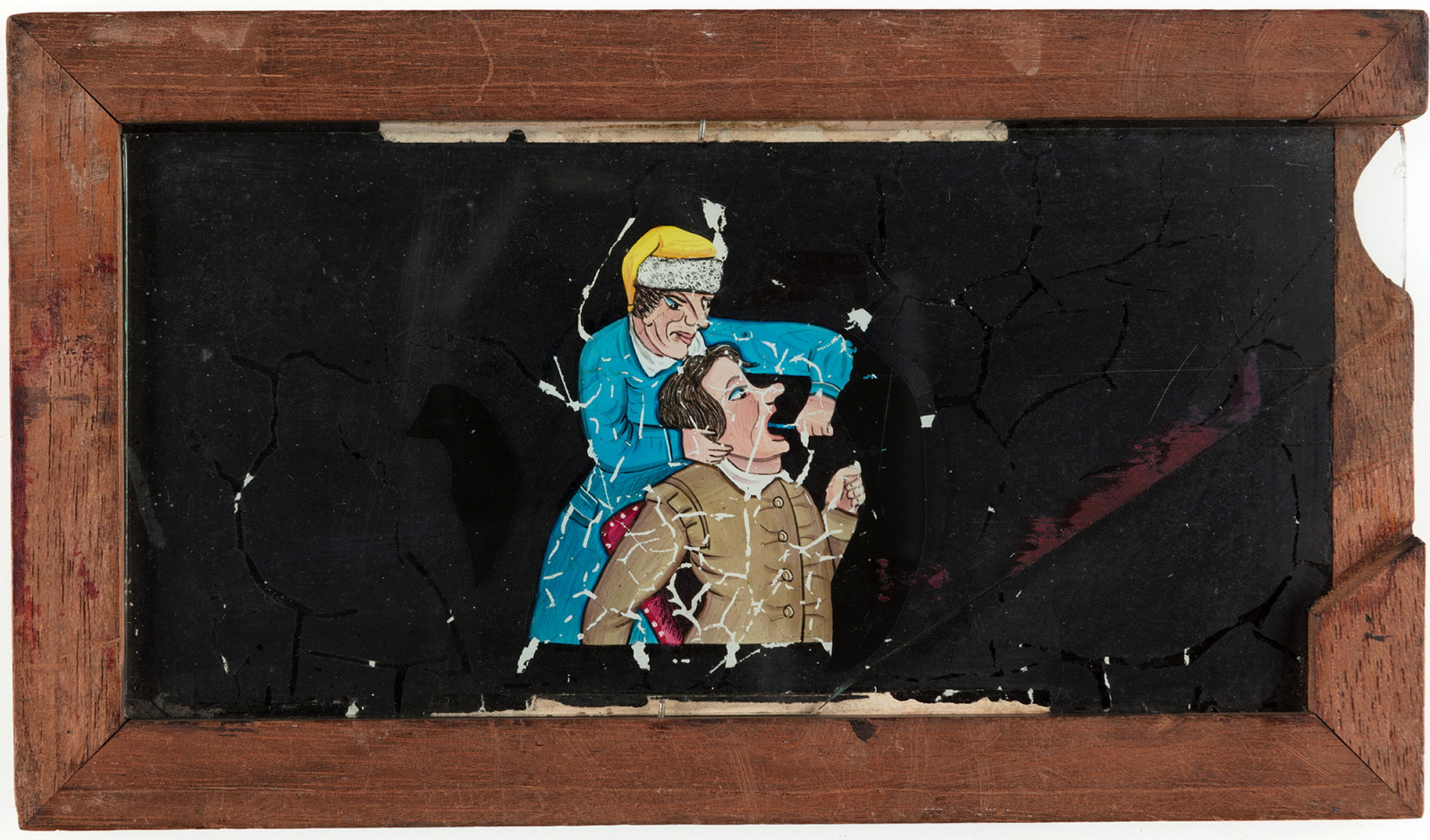 A timber framed glass magic lantern slide featuring a hand-drawn and coloured image of a dentist pulling a tooth. A secondary sliding glass plate provides before and after images of the extraction.