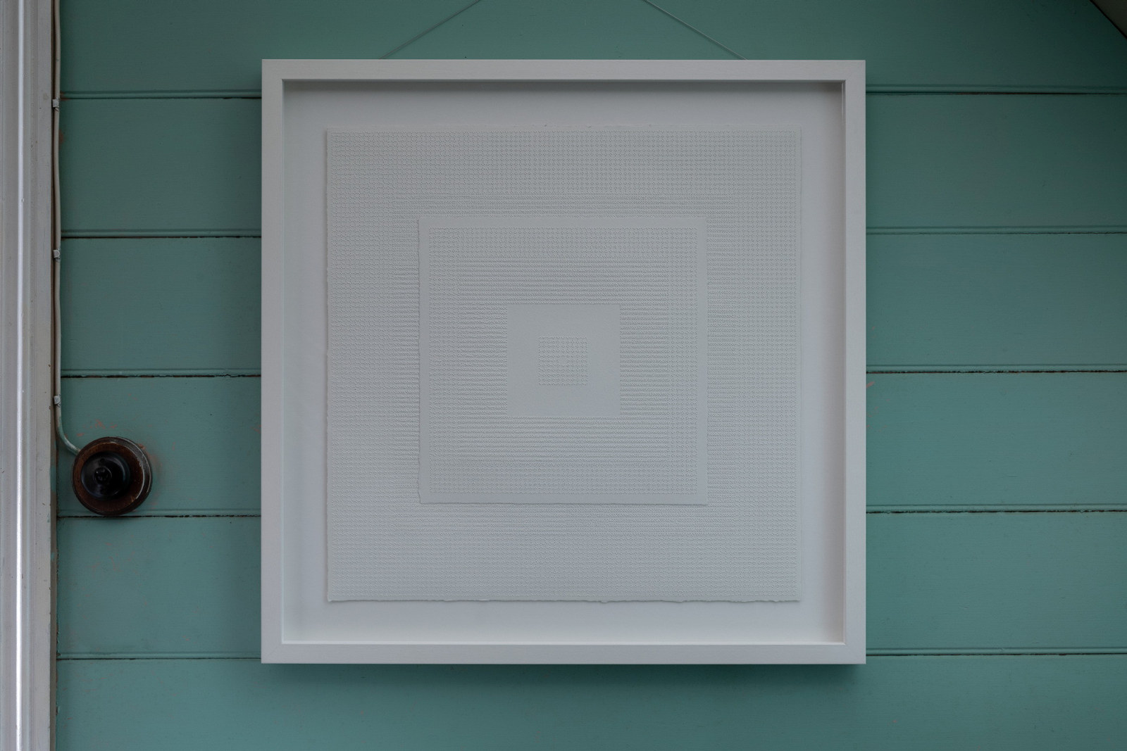 Artwork photographed in situ at Meroogal. Perforated paper in frame.