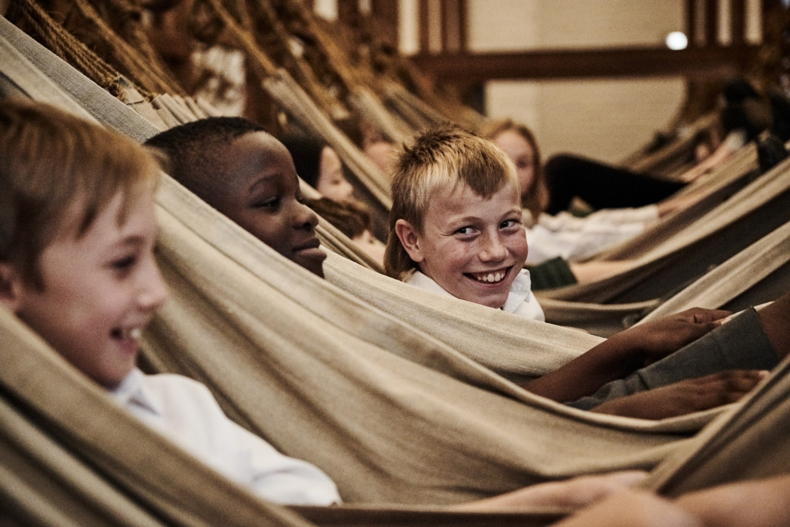 Students laying in the hammocks at Hyde Park Barracks on the Home: Convicts, Migrants & First People Learning program