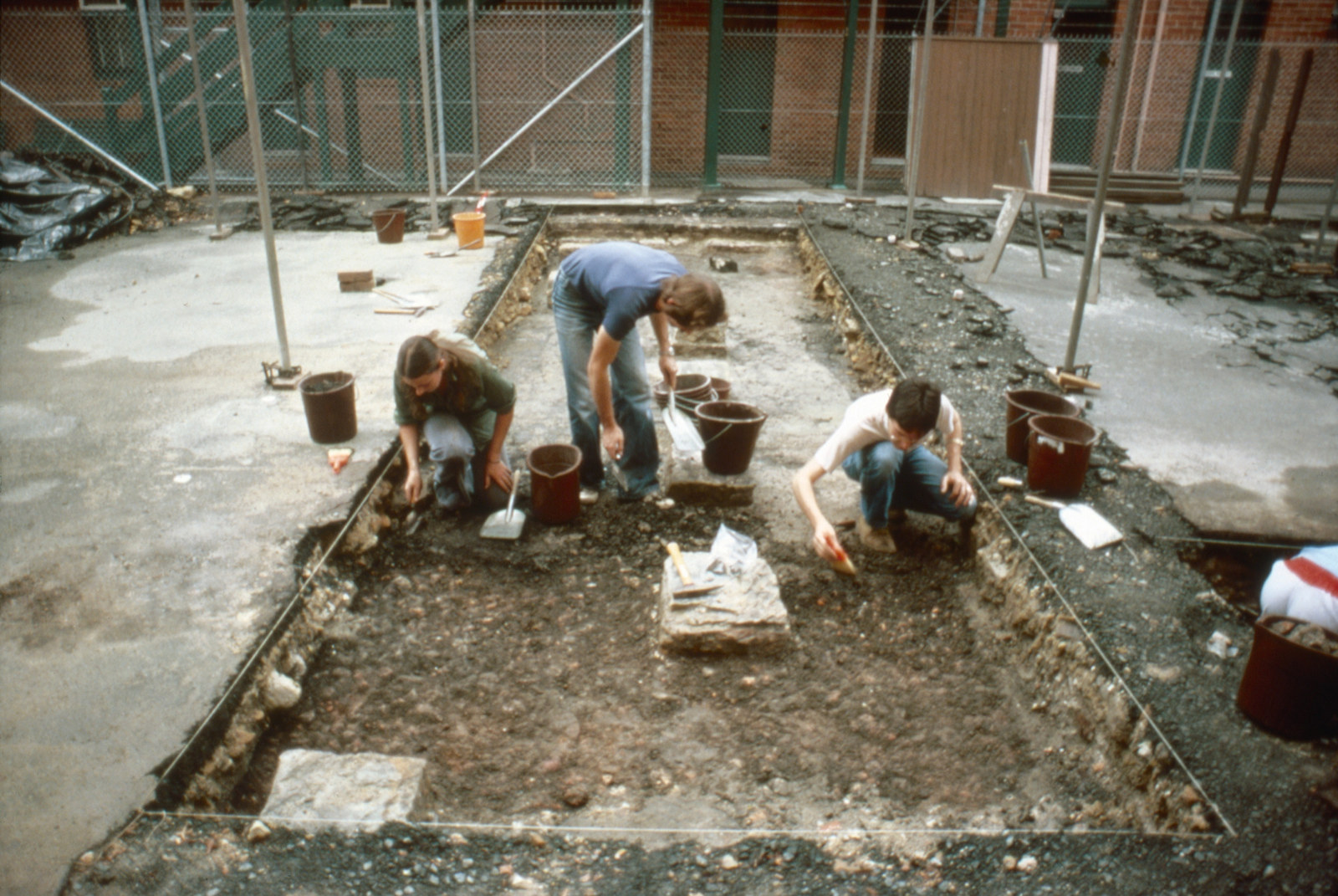 Archaeologists excavating a trench outside the eastern door of Hyde Park Barracks, 1981. From left: Wendy Thorp, Grahame Wilson, Robert Varman.