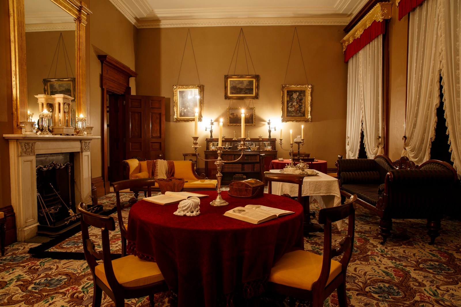 The drawing room, lit by candle light at Elizabeth Bay House