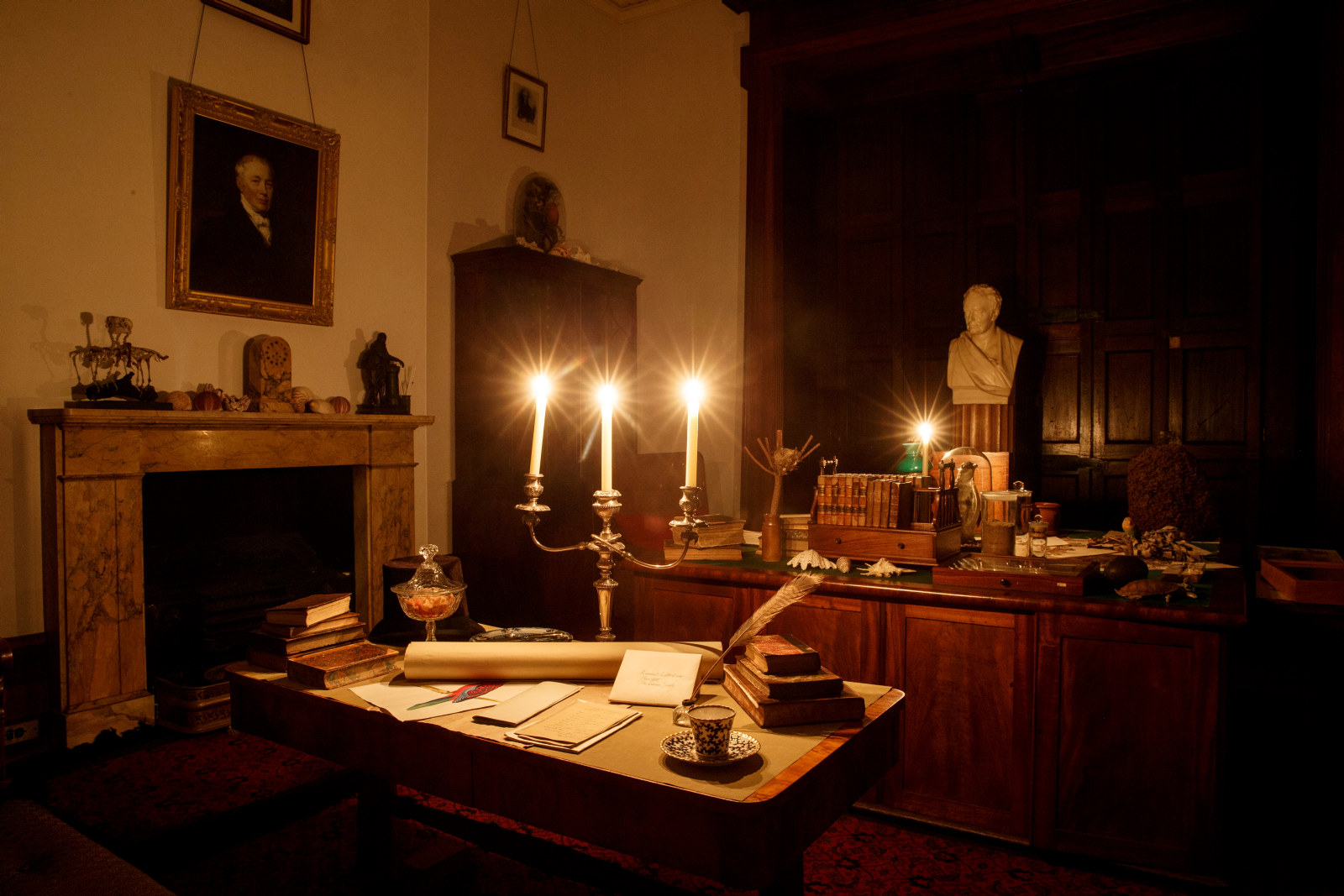 The library, lit by candle light at Elizabeth Bay House