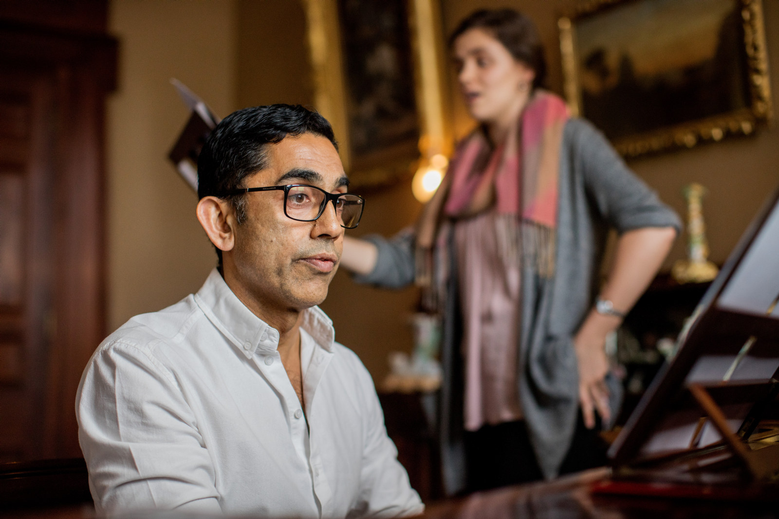 Associate Professor Neal Peres Da Costa (piano) and Nyssa Milligan (singer) from the Historical Performance Unit, Sydney Conservatorium of Music, in the drawing room at Elizabeth Bay House