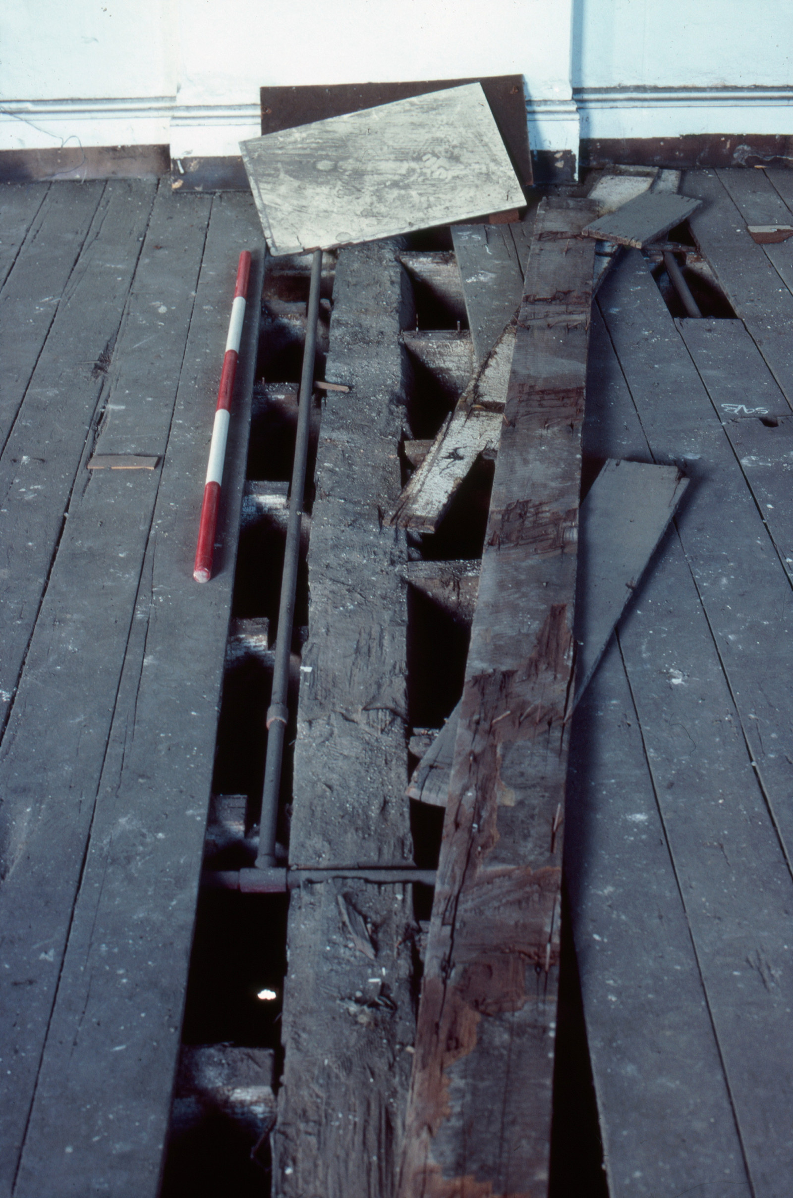 Some of the first floorboards removed before the underfloor excavation of Hyde Park Barracks began, 1980.