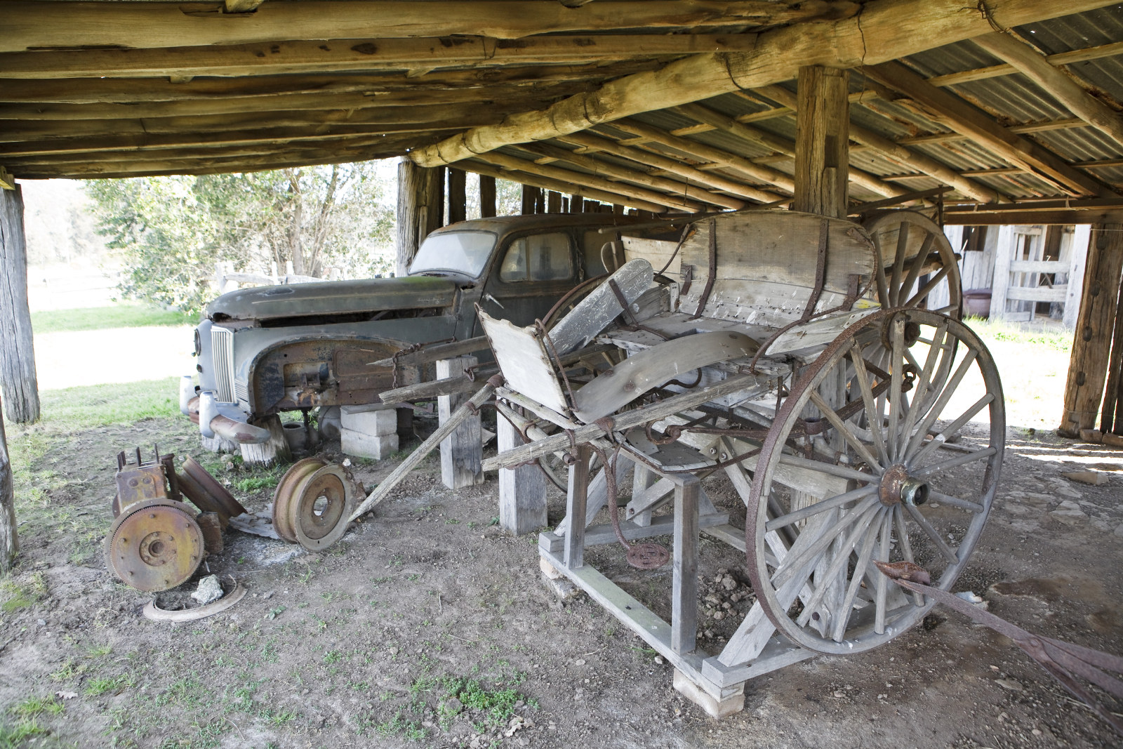 Old car in the cart shed with cart in foreground, Rouse Hill House and Farm.